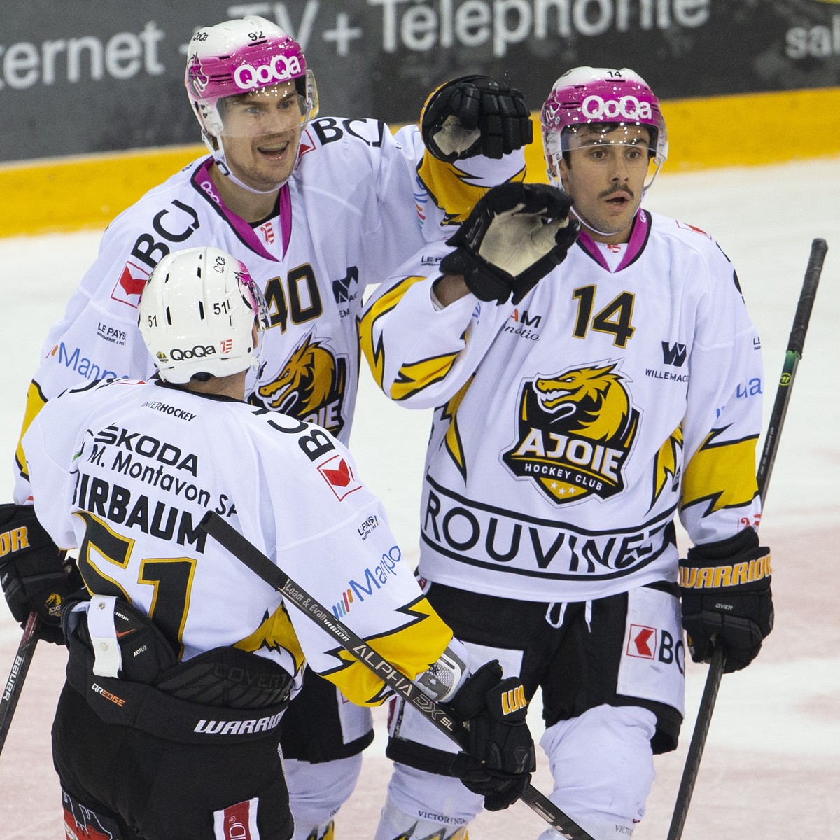 Ajoie's forward Sebastian Wannstroem, of Sweden, center, celebrates his goal with teammates defender Alain Birbaum, left, and forward Maxime Fortier, of Canada, right, after scoring the 3:3, duri ...