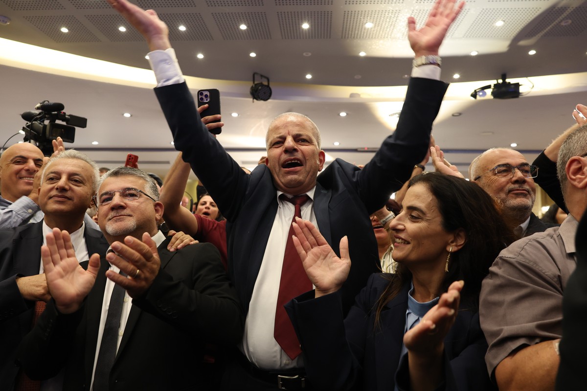 epa13335438 Head of the Joint List alliance Yousef Jabareen (3-L) celebrates with supporters as the first exit polls are announced at the alliance's campaign headquarters in Nazareth, Israel, 27  ...