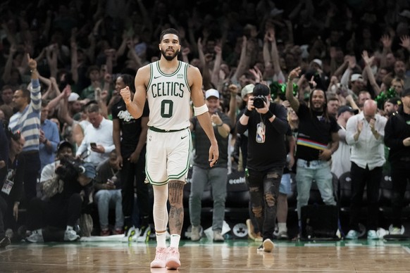 Boston Celtics forward Jayson Tatum (0) reacts as time winds off the clock in overtime of Game 1 of the NBA Eastern Conference basketball finals against the Indiana Pacers, Tuesday, May 21, 2024, in B ...