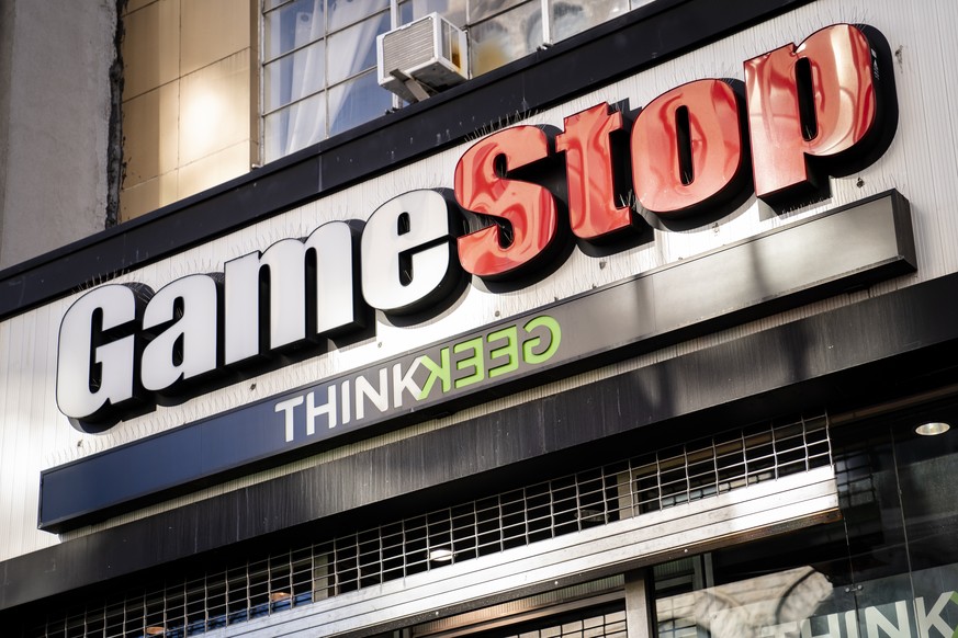 FILE - This Jan. 28, 2021, file photo, shows a GameStop store in New York. Small investors piled into stocks in 2021, at times banding together on online forums like Reddit