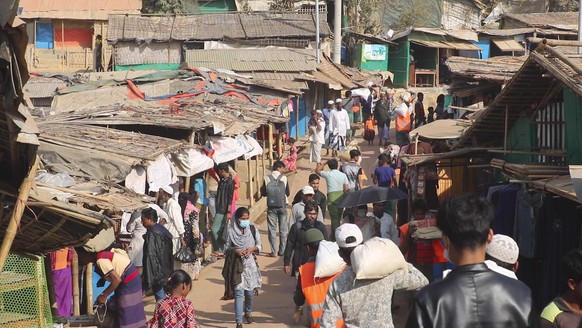 Rohingya refugees walk at the Balukhali refugee camp in Cox&#039;s Bazar, Bangladesh, Tuesday, Feb.2, 2021. Rohingya refugees from Myanmar living in camps in Bangladesh are condemning the military cou ...