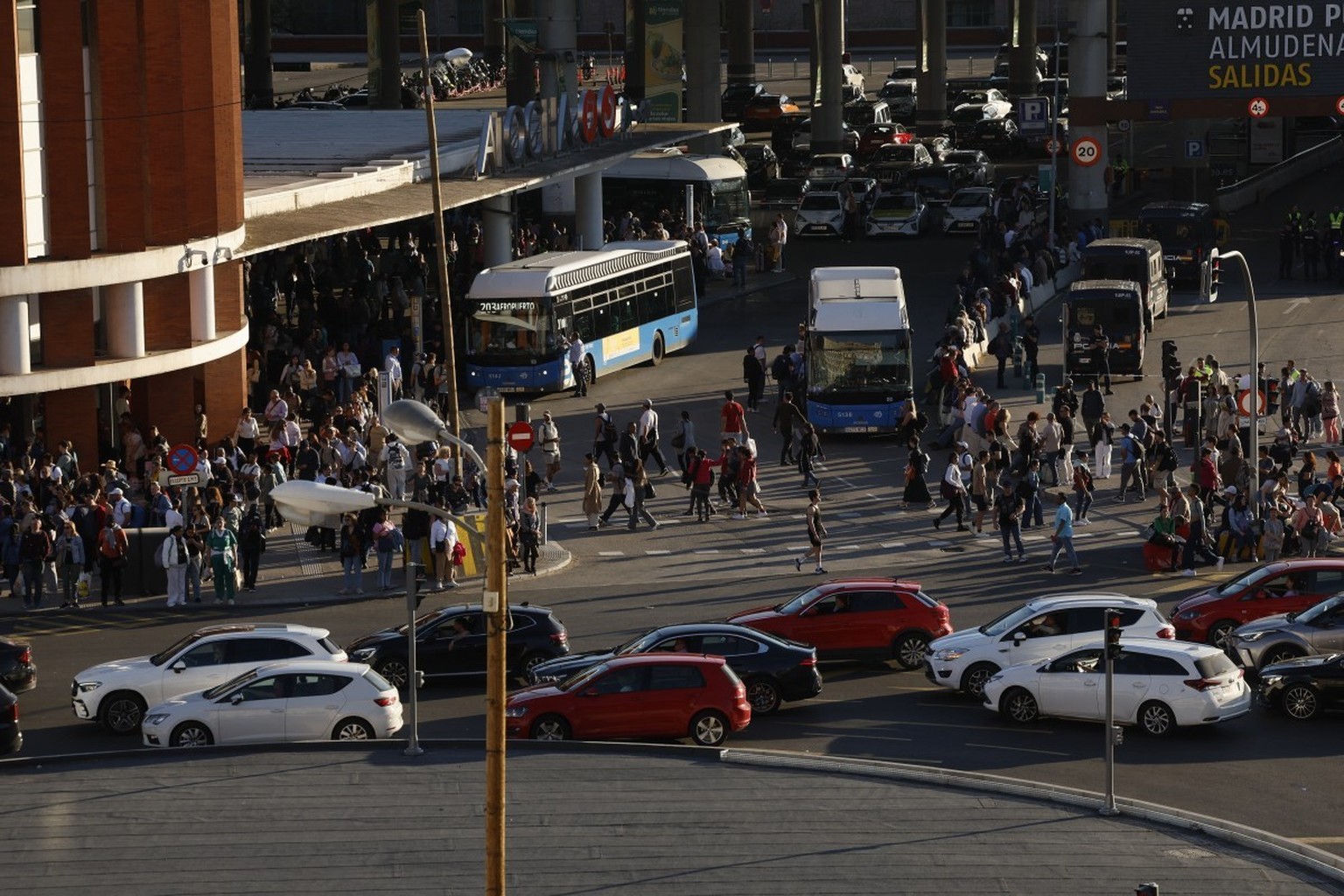 Commuters walk past the Atocha rail station during a massive power cut affecting the entire Iberian peninsula and the south of France, in Madrid on April 28, 2025. A &quot;massive&quot; power cut late ...