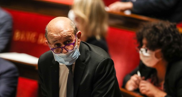 epa08825592 French Foreign Minister Jean-Yves Le Drian participates in a session of Questions to the government at the National Assembly in Paris, France, 17 November 2020. A draft global security leg ...