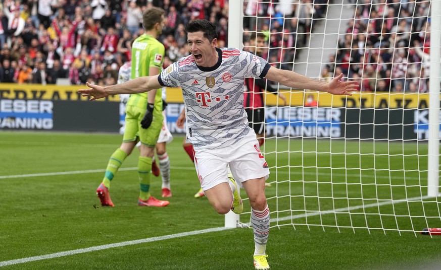 Bayern&#039;s Robert Lewandowski celebrates after scoring the opening goal during the German Bundesliga soccer match between Bayer Leverkusen and Bayern Munich in Leverkusen, Germany, Sunday, Oct. 17, ...