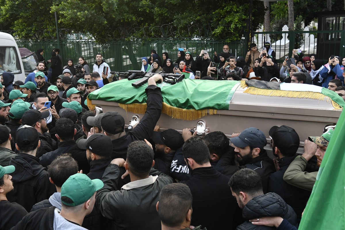 epa11057231 Mourners carry the coffin of Hamas deputy leader Saleh al-Arouri, who was killed in a drone attack, during his funeral in Beirut, Lebanon, 04 January 2024. According to Lebanese state medi ...