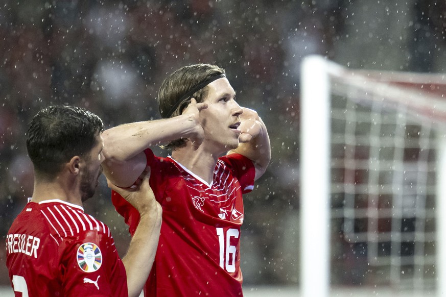 Swiss Cedric Itten, right, celebrates his goal with his teammate Remo Freuler, left, after scoring the 1-0, during the Euro 2024 qualifying group I football match between…