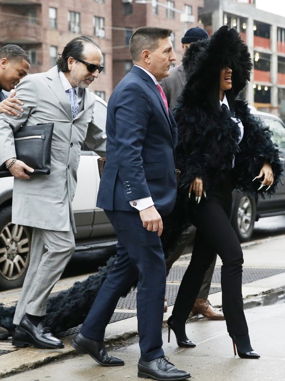 Cardi B arrives at Queens County Criminal Court in New York City on Tuesday, December 10, 2019. The 26-year-old is accused of throwing bottles and chairs at two bartenders at Angels Strip Club in Flus ...