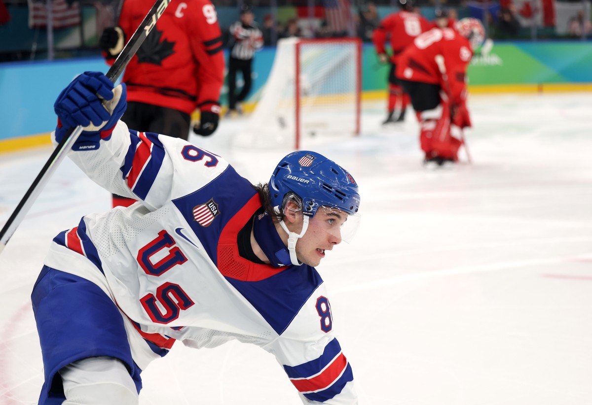 epa12768725 Jackl Eichel of USA celebrates after scoring the winning goal during the Men's Ice Hockey final match between Canada and the USA at the Milano Cortina 2026 Winter Olympic Games in Mil ...