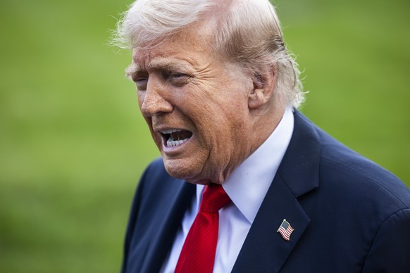 epa12370230 US President Donald Trump speaks to reporters about the murder of Turning Point founder Charlie Kirk as he leaves the White House for New York City in Washington, DC, USA, 11 September 202 ...