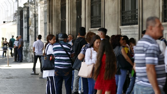 epa11482118 People line up at the Spanish embassy in Havana, Cuba, 16 July 2024. The Cuban parliament will begin deliberations on proposed immigration, citizenship, and immigration laws on July 17. Th ...