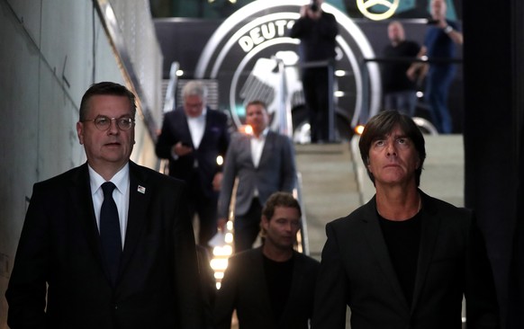 epaselect epa06738103 Reinhard Grindel (L), President of the German Football Association (DFB) and Joachim Loew, head coach of the German national soccer team, arrive for the announcement of the provi ...