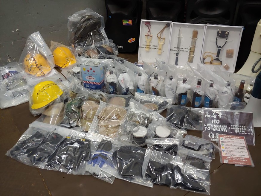 Confiscated equipments and weapons are displayed in Hong Kong on Saturday, July 20, 2019. Police in Hong Kong have raided a homemade-explosives manufacturing lab ahead of another weekend of protests i ...