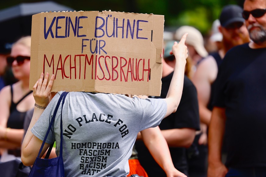 epa10747832 People protest before a scheduled concert of German hard-rock band Rammstein in Berlin, Germany, 15 July 2023. Protesters are demanding the cancellations of the concerts over accusations o ...