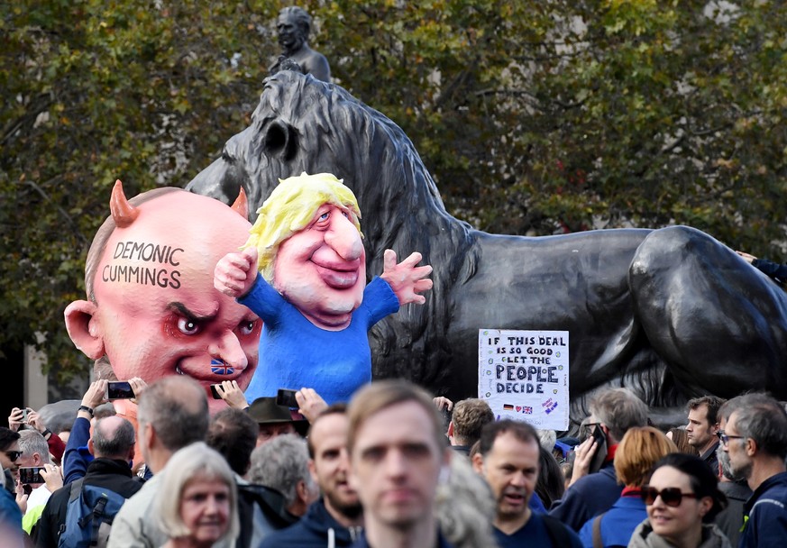 epa07933728 Protesters during the 'Together for the Final Say' march against Brexit in London, Britain, 19 October 2019. Hundreds of thousands of people are taking part in the protest march calling fo ...