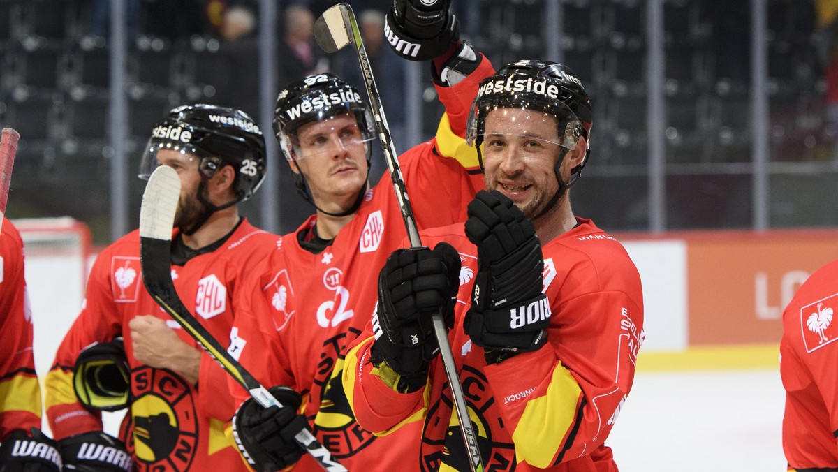 Bern's Beat Gerber, right, Andrew Ebbett, left, and Gaetan Haas, center, celebrate the victory (4-3) during the Champions Hockey League group G match between Switzerland's SC Bern and Sweden ...