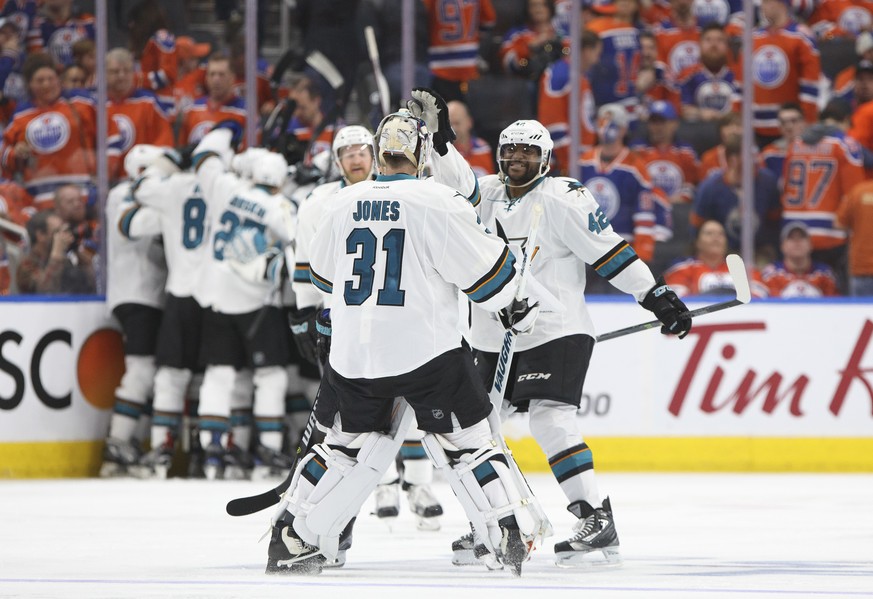 San Jose Sharks&#039; Joel Ward (42) and Martin Jones (31) celebrate the team&#039;s overtime win over the Edmonton Oilers in Game 1 of an NHL hockey first-round playoff series Wednesday, April 12, 20 ...
