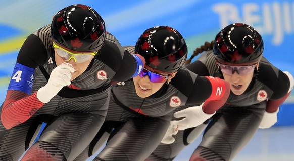epa09757785 Team Canada in action during the Women's Speed Skating Team Pursuit semi final at the Beijing 2022 Olympic Games, Beijing, China, 15 February 2022.  EPA/ALEX PLAVEVSKI