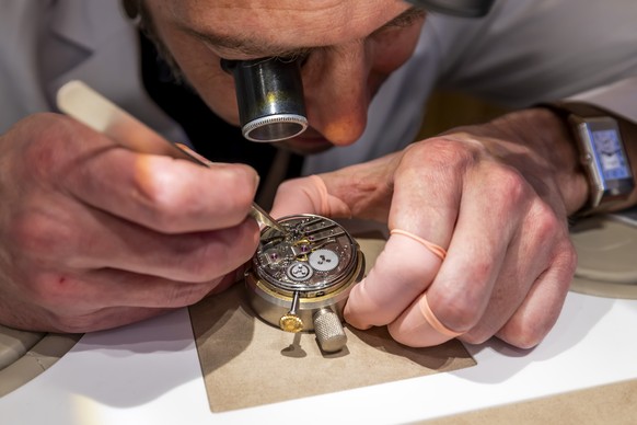 KEYPIX - A watchmaker of Jaeger-LeCoultre assembles a movement of a watch at the Swiss manufacture Jaeger-LeCoultre stand stand during the &quot;Watches and Wonders Geneva&quot; luxury watch fair, in  ...