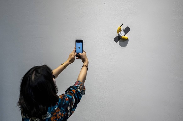 December 5, 2021, Beijing, Hebei, China: Banana taped to the wall at Maurizio Cattelan The Last Judgment art exhibition at UCCA Center for Contemporary Art in Beijing, China on 05/12/2021 by Beijing…