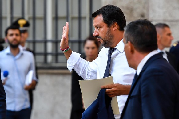 epa06956540 Italian Vice-Prime Minister and Minister of the Interior Matteo Salvini (C) leaves the Prefecture of Genoa after a special Council of Ministers after the State funerals of victims of the M ...