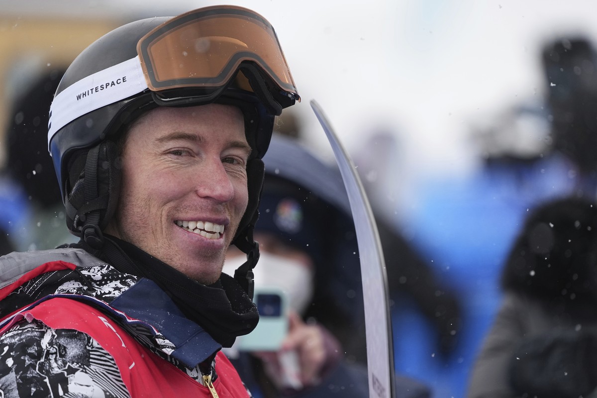 United States' Shaun White talks to reporters after competing during the men's halfpipe qualification round at the 2022 Winter Olympics, Wednesday, Feb. 9, 2022, in Zhangjiakou, China. (AP P ...