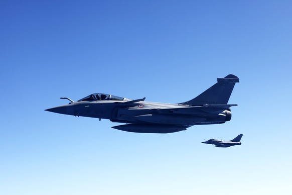 epa12435417 Two French Air Force Rafale fighter jets participate in the air combat drill 'VOLFA', in Istres, France, 06 October 2025. VOLFA is the annual operational readiness exercise for t ...