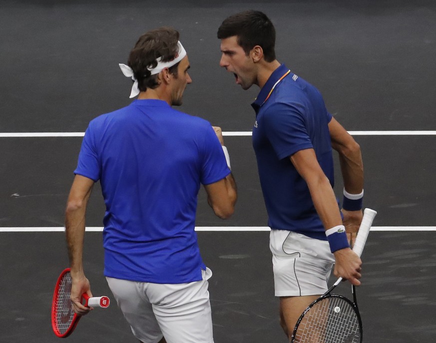 Team Europe&#039;s Roger Federer, left, and Novak Djokovic celebrate a point against Team World&#039;s Jack Sock and Kevin Anderson during a doubles tennis match at the Laver Cup, Friday, Sept. 21, 20 ...