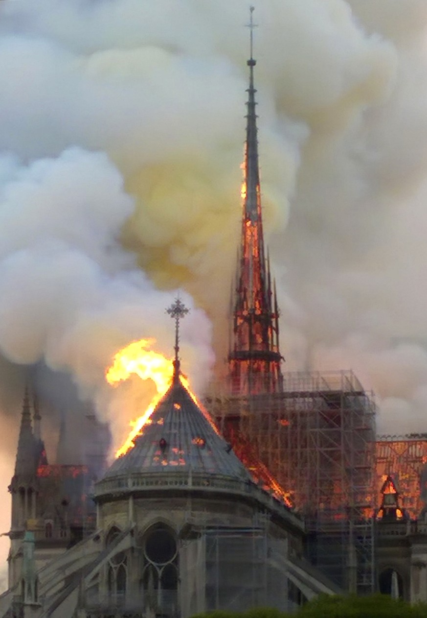The spire and parts of Notre Dame cathedral is on fire in Paris, Monday, April 15, 2019. A catastrophic fire engulfed the upper reaches of Paris&#039; soaring Notre Dame Cathedral as it was undergoing ...
