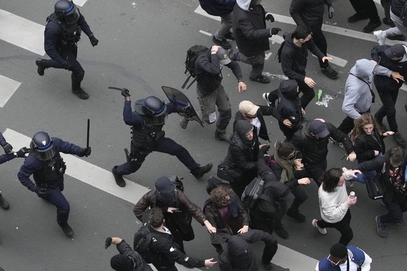 Riot police scuffle with protesters during a rally in Paris, Thursday, march 23, 2023. French unions are holding their first mass demonstrations Thursday since President Emmanuel Macron enflamed publi ...