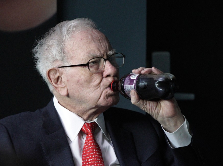 Warren Buffett, chairman and CEO of Berkshire Hathaway, drinks Cherry Coke while playing bridge outside Berkshire-owned Borsheims jewelry store in Omaha, Neb., Sunday, May 6, 2018. On Saturday, tens o ...