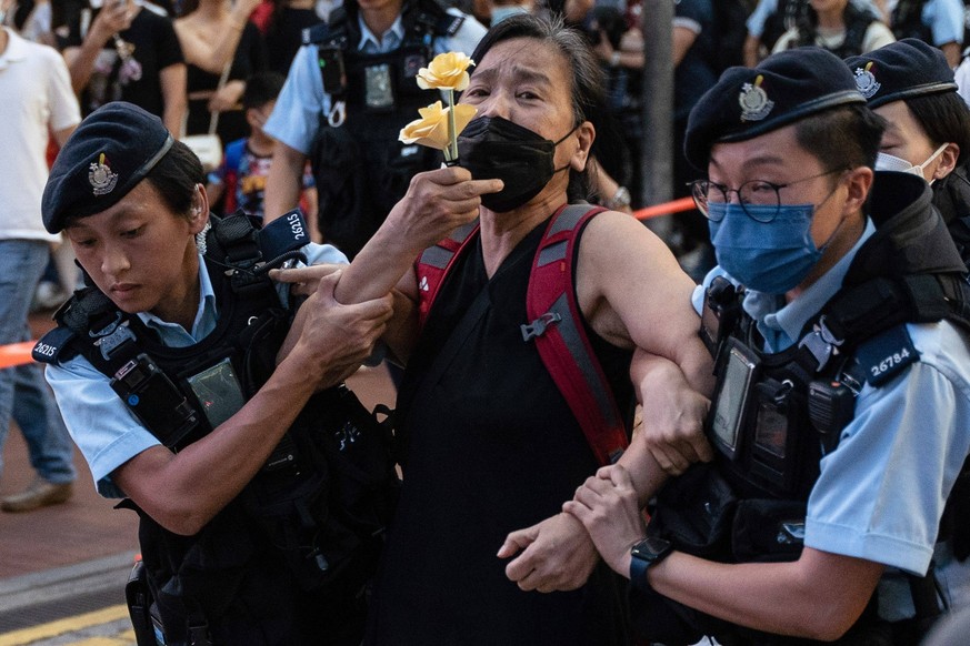 April 6, 2023, Hong Kong, China: Police officers detain Chan Po-Ying, chairperson of the League of Social Democrats at Causeway Bay. June 4th, is the 34th anniversary of the 1989 Beijing s Tiananmen S ...