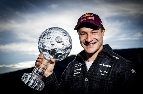 Marco Odermatt of Switzerland poses with the men's overall crystal globe trophy at the Lillehammer FIS Alpine Ski World Cup Finals, in Hafjell, Norway, Wednesday, March 25, 2026. (KEYSTONE/Jean-C ...