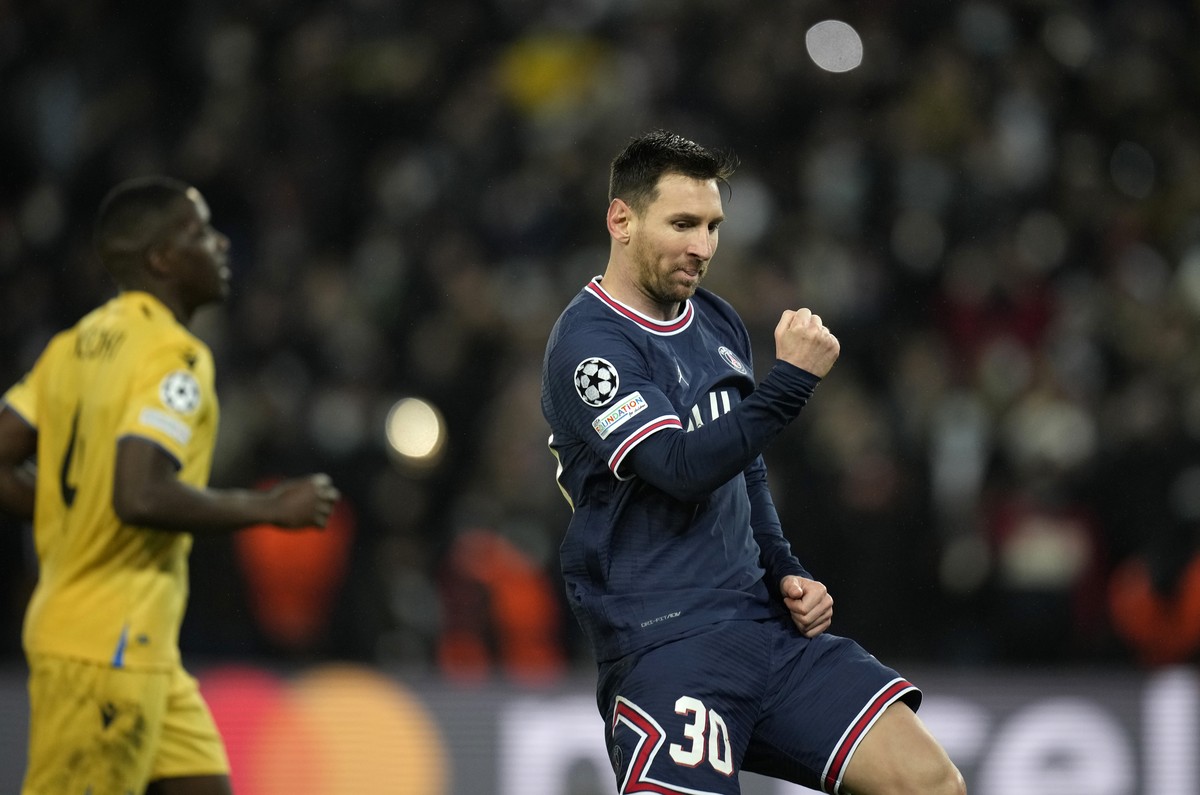PSG's Lionel Messi celebrates after scoring his side's fourth goal during the Champions League Group A soccer match between PSG and Club Brugge at the Parc des Princes stadium in Paris, Fran ...