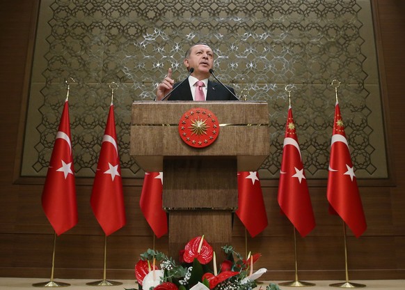 epa05778020 A handout photo made available by the Turkish President Press office shows Turkish President Recep Tayyip Erdogan speaking during mukhtars (local administrators) meeting in Ankara, Turkey, ...