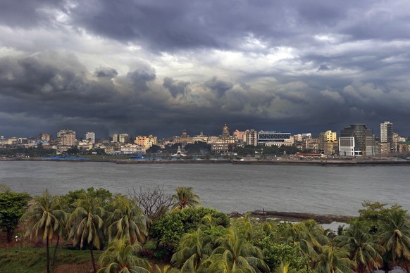 epa11239725 Dark clouds over the city skyline during a rainy day in Havana, Cuba on March 23, 2024.  The heavy rains that affected the western part of Cuba since March 22 caused 270,000 r ...
