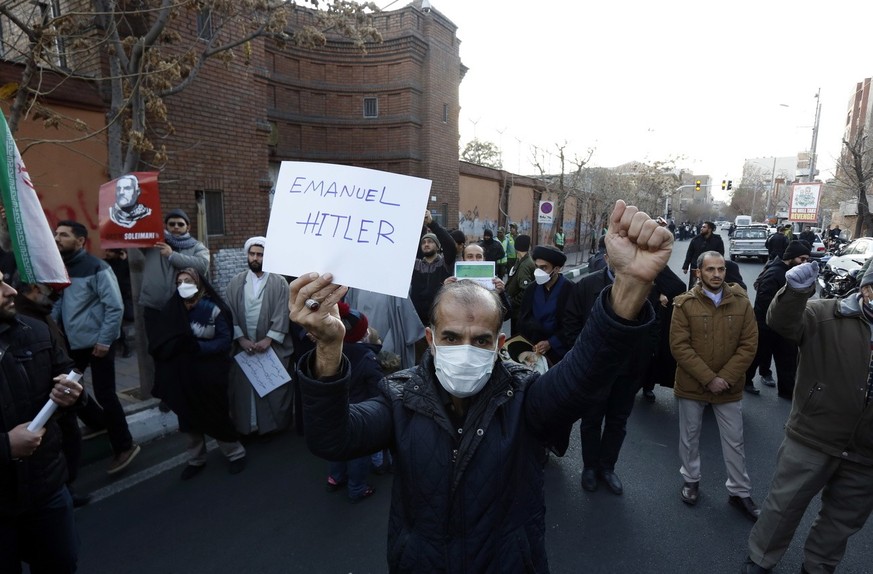 epa10395738 Iranians take part during an anti-France protest demonstration in front of the French embassy in Tehran, Iran, 08 January 2023. Iran harshly condemned the publication of cartoons depicting ...