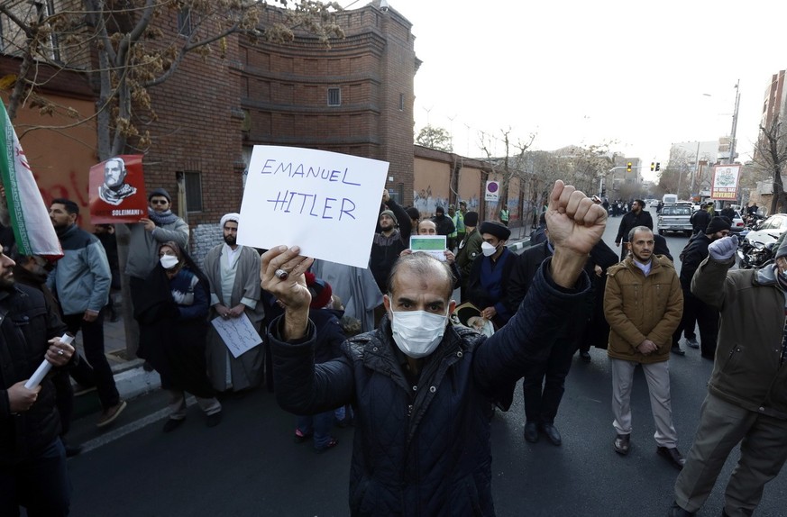 epa10395738 Iranians participate in a protest demonstration against France in front of the French embassy in Tehran, Iran, January 08, 2023. Iran has banned the publication of cartoons featuring ...