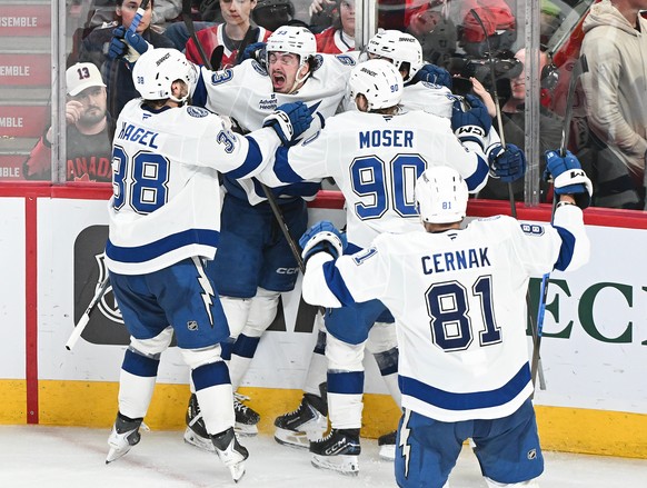 Tampa Bay Lightning's Gage Goncalves, second from left, celebrates with teammates after scoring against the Montreal Canadiens during overtime of Game 6 in the first round of an NHL hockey Stanle ...