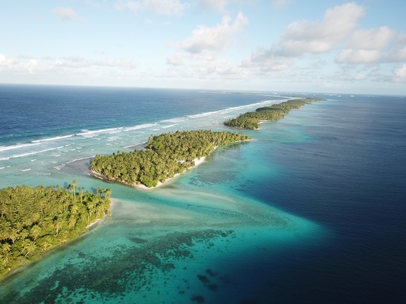 This Oct. 23, 2017 aerial photo shows the thin strip of coral atolls separating the ocean from the lagoon in Majuro, Marshall Islands. (AP Photo/Nicole Evatt)