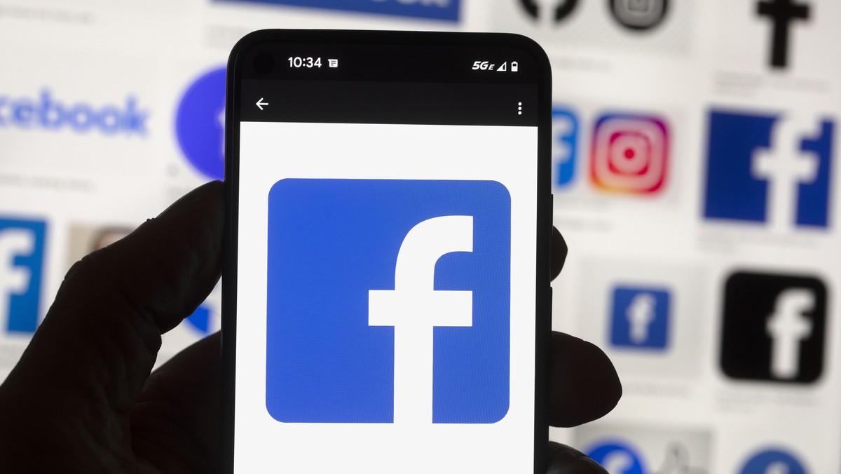FILE - The Facebook logo is seen on a cell phone, Friday, Oct. 14, 2022, in Boston. Facebook parent Meta is reinstating former President Donald Trump's personal account after two-year suspension  ...