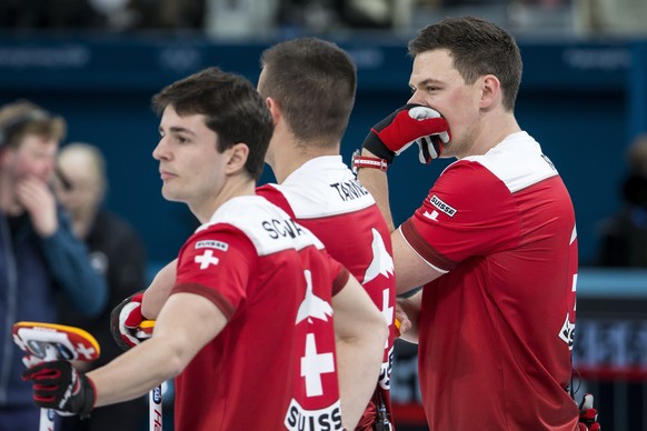 Benoit Schwarz, Valentin Tanner and Claudio Paetz of Switzerland, from left, during the Curling round robin game of the men between Switzerland and Italy at the XXIII Winter Olympics 2018 in Gangneung ...