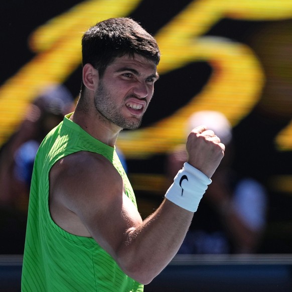 Carlos Alcaraz of Spain reacts after defeating Corentin Moutet of France in their third round match at the Australian Open tennis championship in Melbourne, Australia, Friday, Jan. 23, 2026. (AP Photo ...