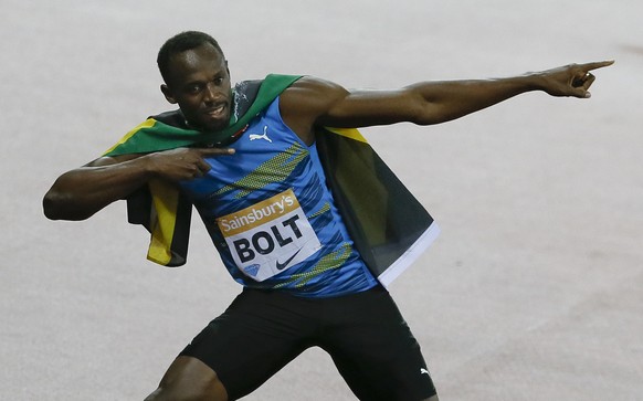 Usain Bolt of Jamaica celebrates after he wins the men&#039;s 100m final during the Diamond League athletics meeting at the Olympic Stadium in the Queen Elizabeth Olympic Park in London, Friday, July  ...