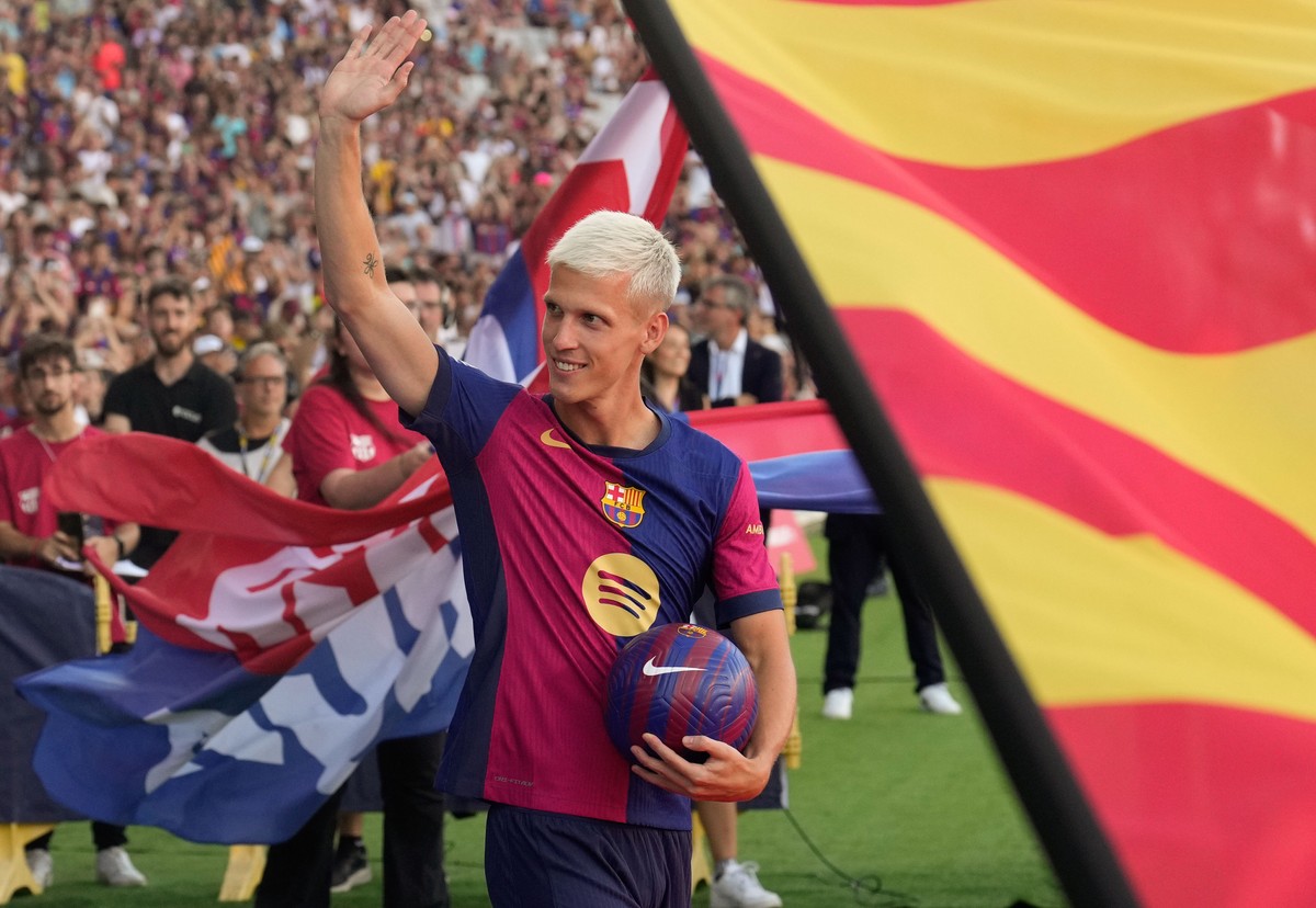 epa11546882 FC Barcelona's Dani Olmo in action during his presentation as a new player ahead of the Joan Gamper trophy soccer match between FC Barcelona and Monaco at the Lluis Companys stadium i ...