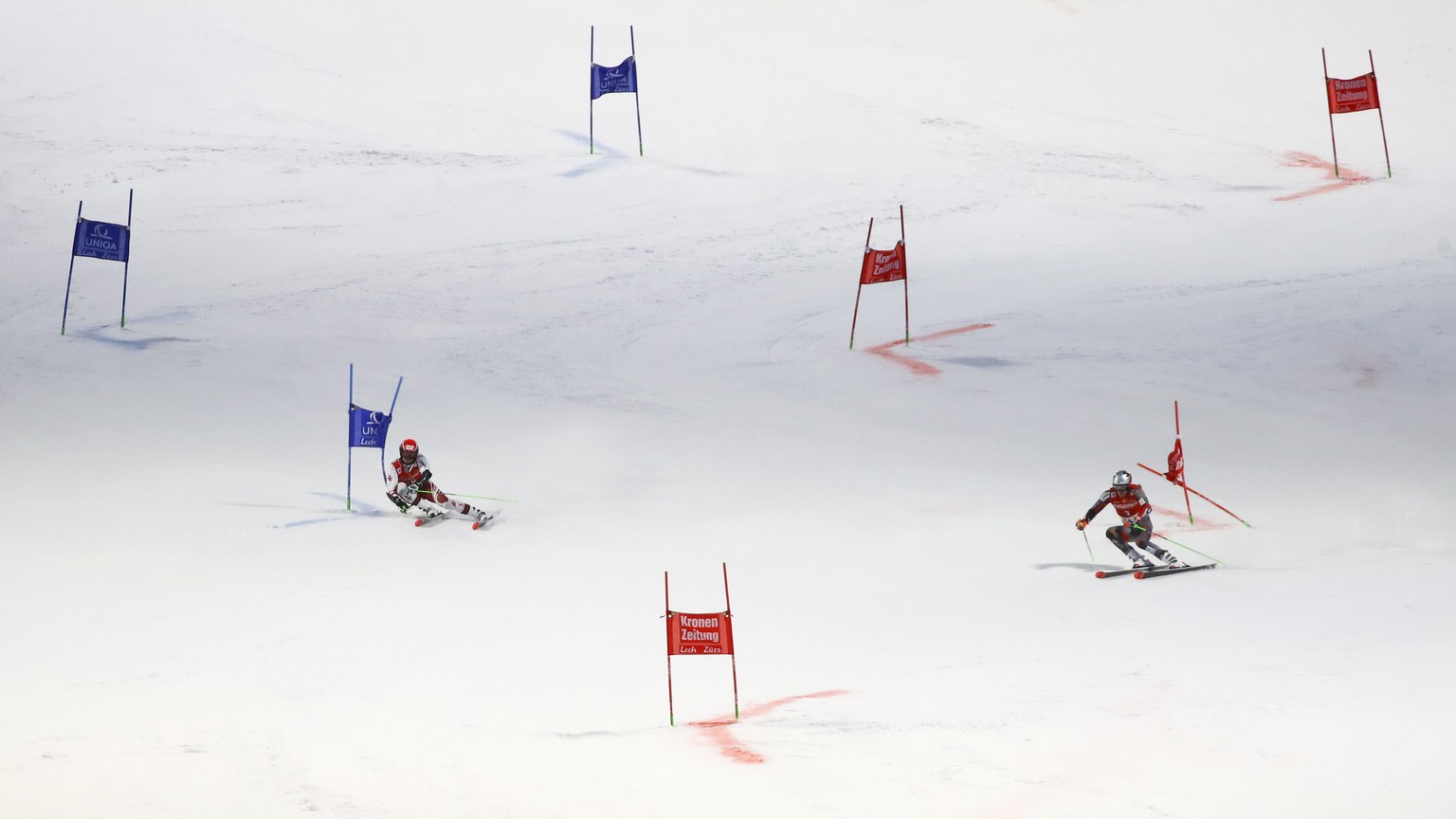Austria&#039;s Christian Hirschbuehl, left, competes alongside Norway&#039;s Henrik Kristoffersen during an alpine ski, men&#039;s World Cup parallel event, in Lech/Zuers, Austria, Sunday, Nov. 14, 20 ...