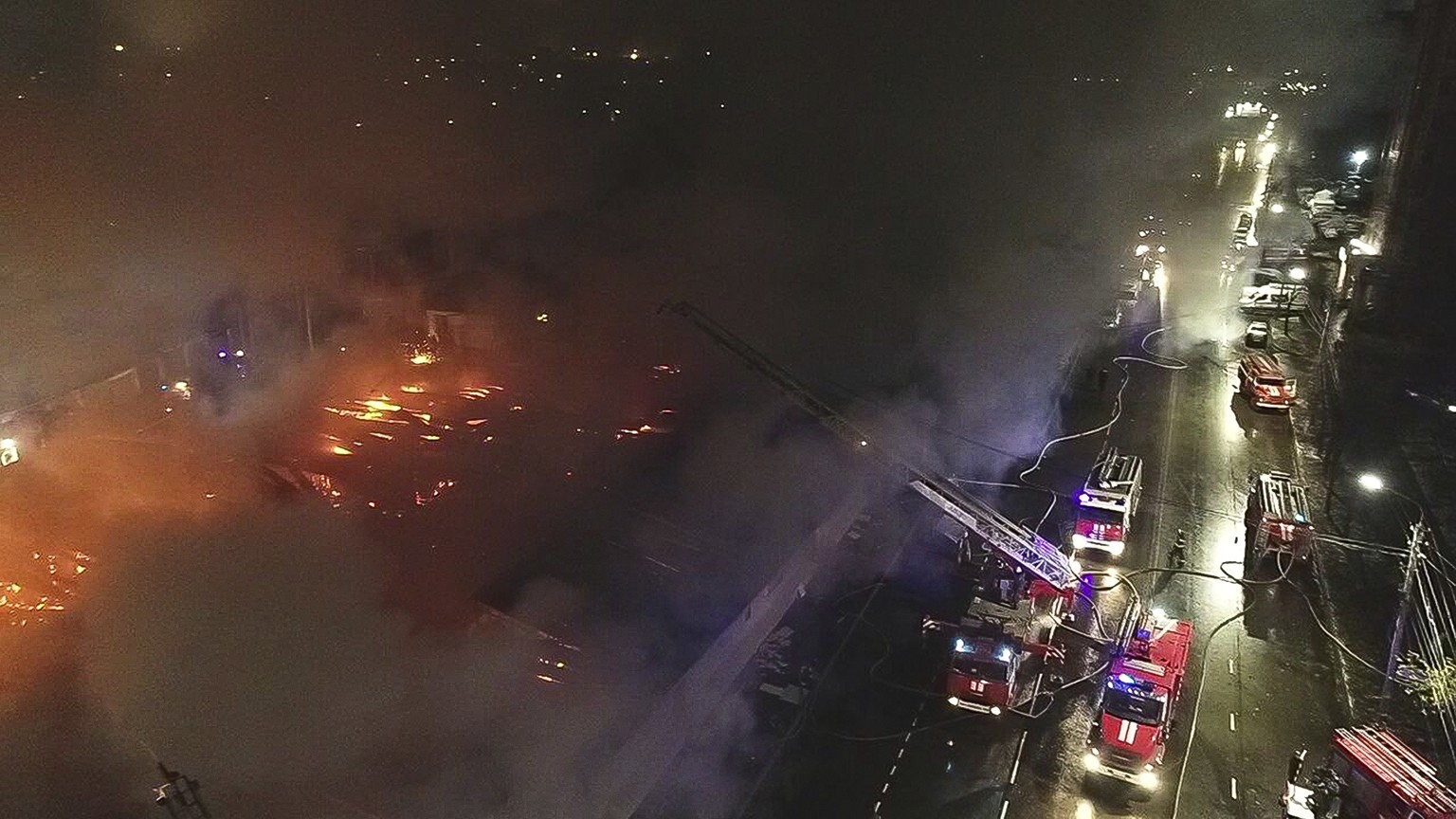 In this handout photo released by Russian Emergency Ministry Press Service, firefighters extinguish a fire of a cafe in Kostroma, Russia, Saturday, Nov. 5, 2022. Russia emergency officials say a fire  ...