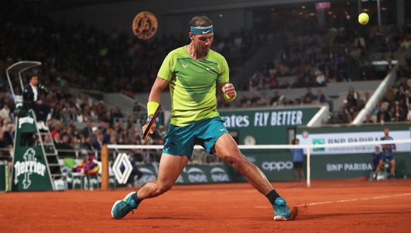 epa09975830 Rafael Nadal of Spain celebrates a point in the men&#039;s second round match against Corentin Moutet of France during the French Open tennis tournament at Roland Garros in Paris, France,  ...