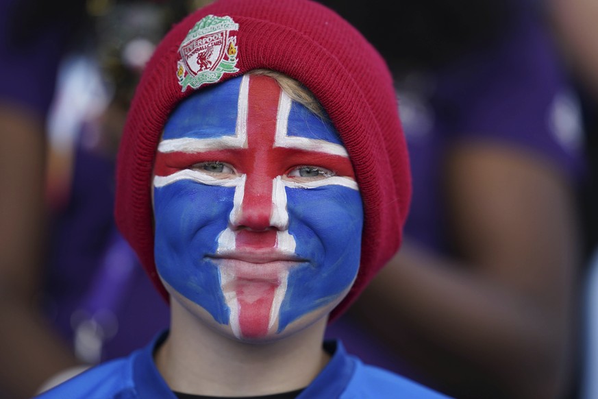 An Iceland supporter smiles prior to the start of the Women Euro 2022 soccer match between Italy and Iceland at the Manchester City Academy Stadium, in Manchester, Thursday, July 14, 2022. (AP Photo/J ...
