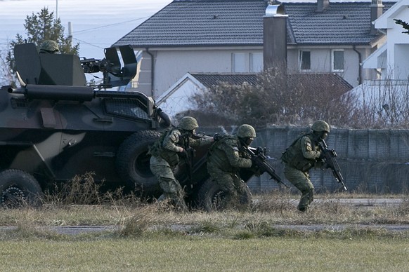 Members of Kosovo&#039;s Security Forces take part in a exercise in southeastern town of Gjilan, Kosovo on Thursday, Dec. 13, 2018, a day before the parliament votes to transform them into a regular a ...