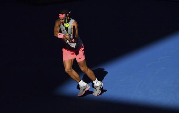 Spain&#039;s Rafael Nadal makes a backhand return to Argentina&#039;s Leonardo Mayer during their second round match at the Australian Open tennis championships in Melbourne, Australia, Wednesday, Jan ...